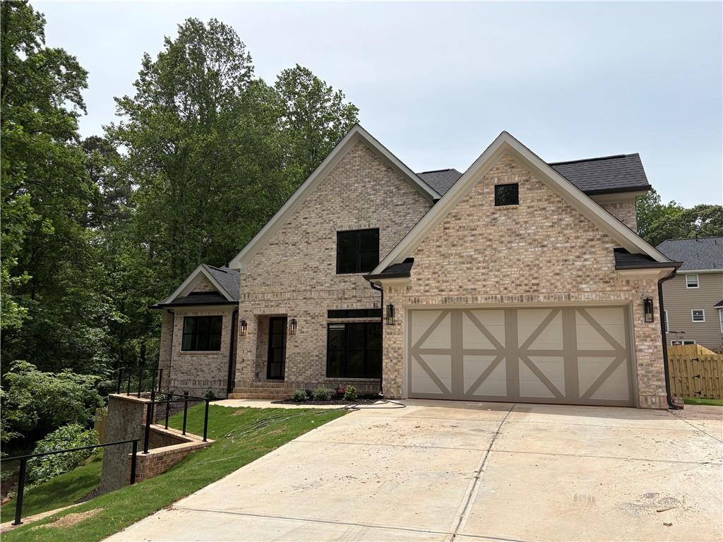 a front view of a house with garage