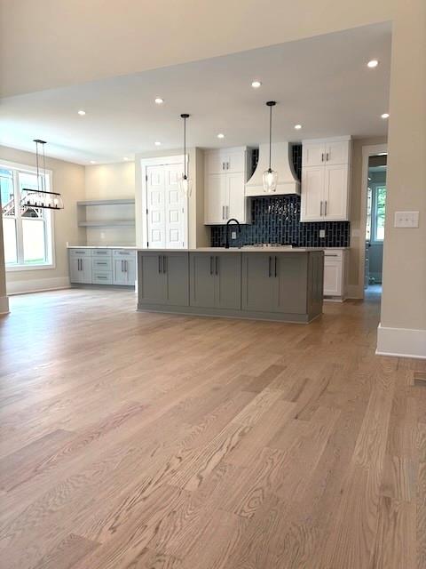 131 West Putnam Ferry Road Woodstock, GA 30189 - Photo 11 of 22 a large kitchen with stainless steel appliances kitchen island a large counter top and a stove