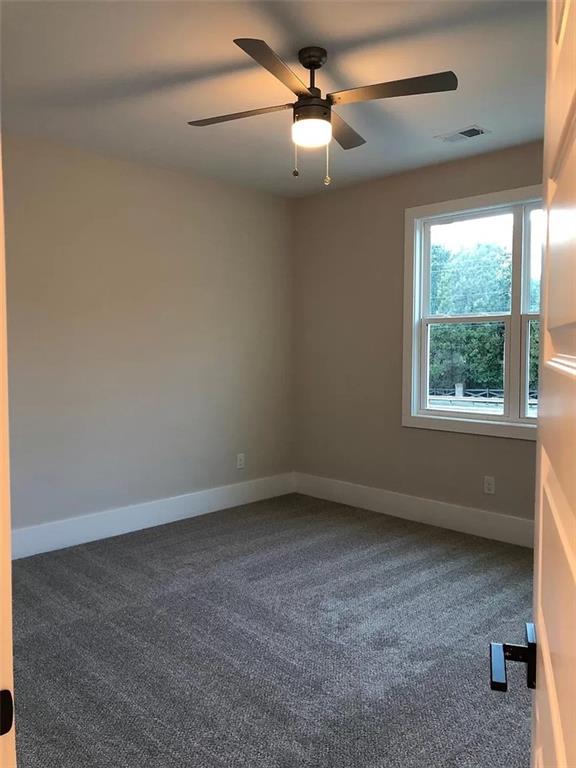 131 West Putnam Ferry Road Woodstock, GA 30189 - Photo 14 of 22 an empty room with a window