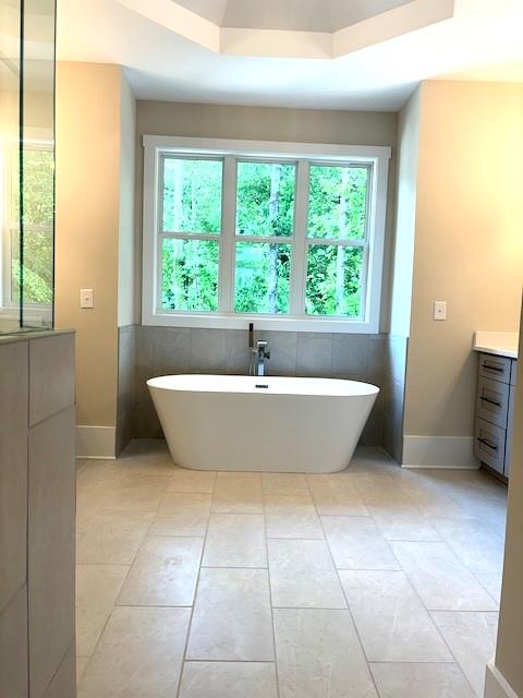 131 West Putnam Ferry Road Woodstock, GA 30189 - Photo 20 of 22 a view of a bathtub in a room next to a window