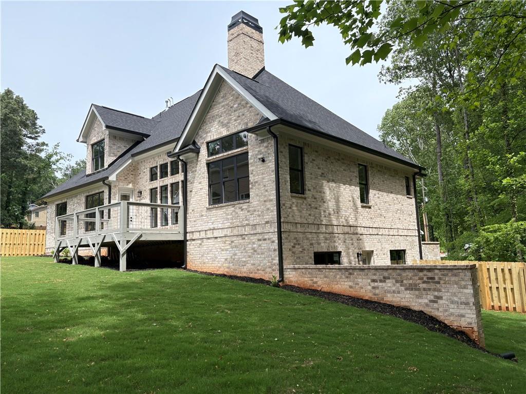 131 West Putnam Ferry Road Woodstock, GA 30189 - Photo 2 of 22 a view of house with garden
