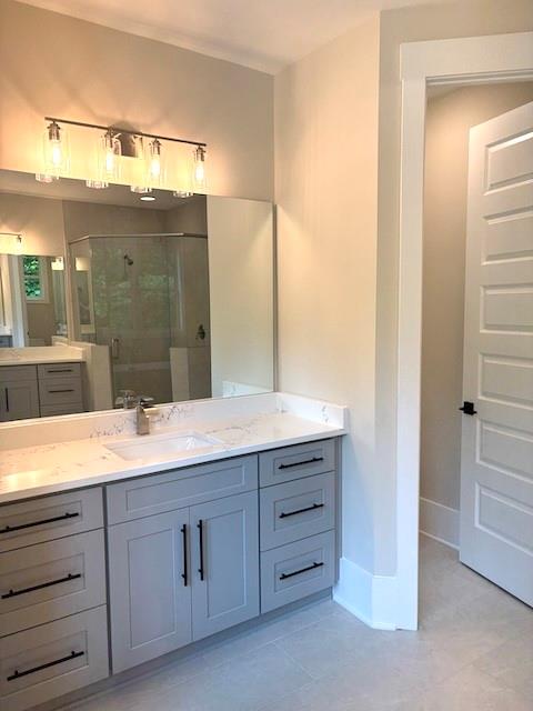 131 West Putnam Ferry Road Woodstock, GA 30189 - Photo 22 of 22 a bathroom with a granite countertop sink mirror and