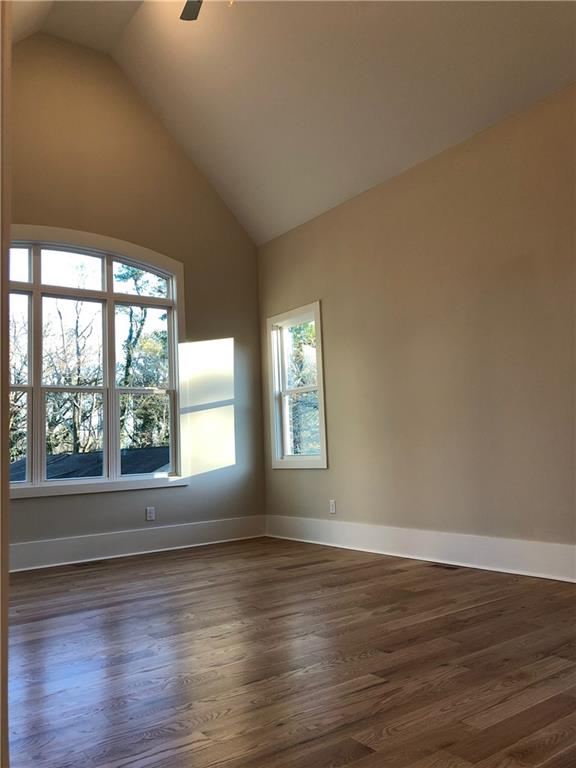 131 West Putnam Ferry Road Woodstock, GA 30189 - Photo 9 of 22 a view of an empty room with wooden floor and a window