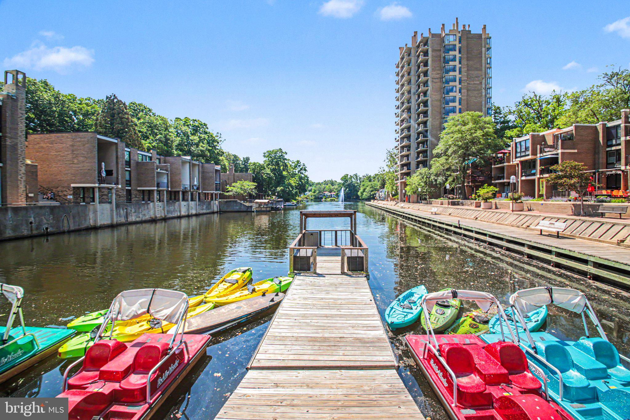 1417 Northgate Square, Unit 1A Reston, VA 20190 - Photo 24 of 24 Serene waterfront with vibrant boats.