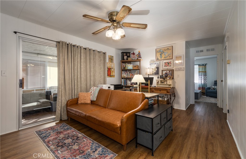 4133 West Wilson Street, Unit 168 Banning, CA 92220 - Photo 13 of 25 a living room with furniture and a rug