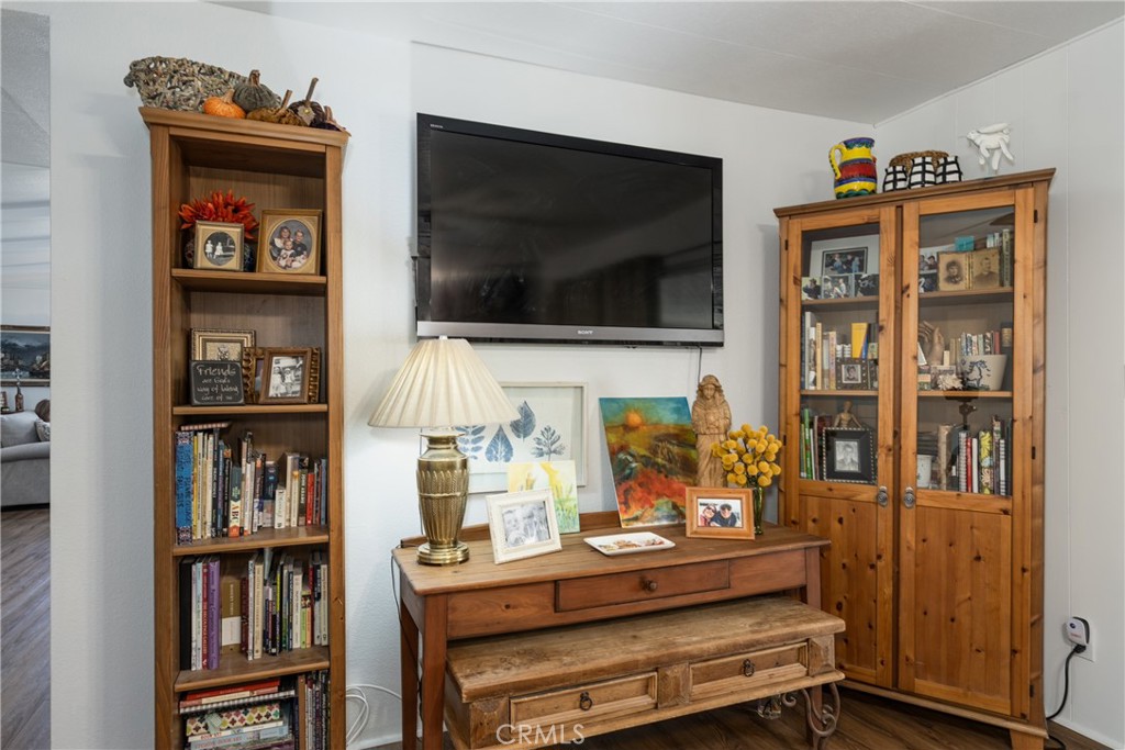 4133 West Wilson Street, Unit 168 Banning, CA 92220 - Photo 14 of 25 a room with furniture and a flat screen tv