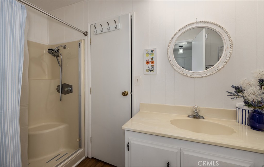 4133 West Wilson Street, Unit 168 Banning, CA 92220 - Photo 19 of 25 a bathroom with a sink a toilet and shower