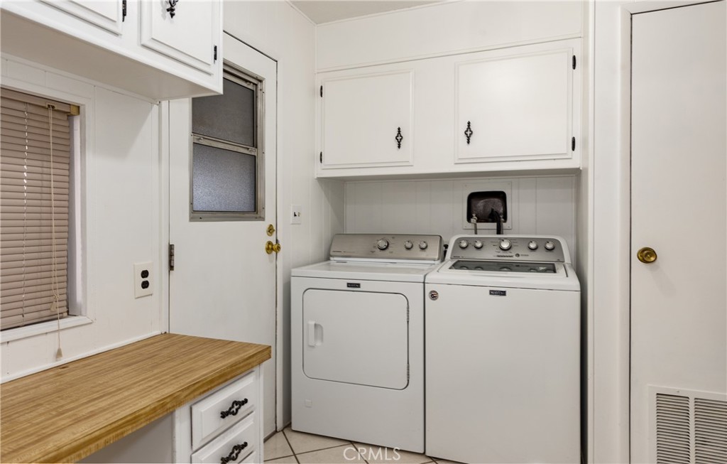 4133 West Wilson Street, Unit 168 Banning, CA 92220 - Photo 20 of 25 a view of storage and utility room with washer and dryer