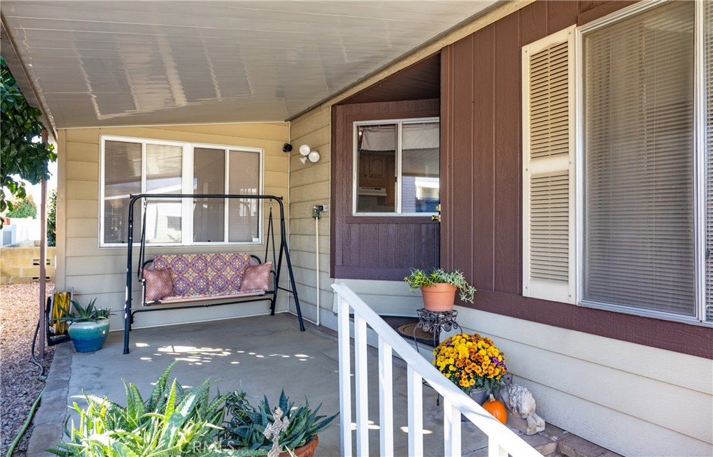 4133 West Wilson Street, Unit 168 Banning, CA 92220 - Photo 2 of 25 a front view of a house with outdoor seating