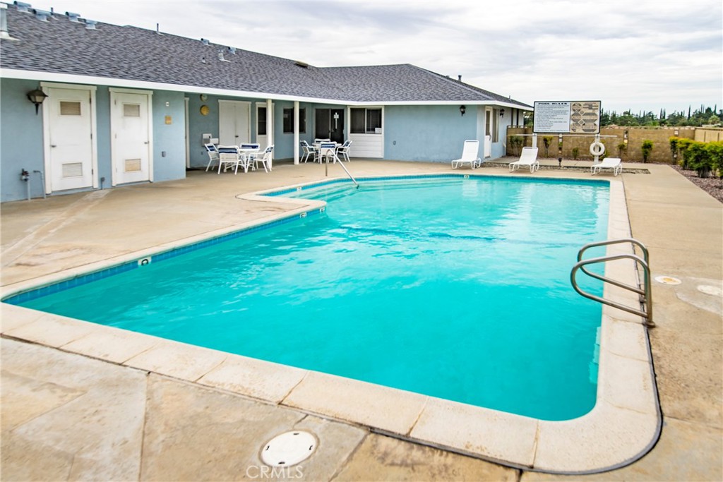 4133 West Wilson Street, Unit 168 Banning, CA 92220 - Photo 23 of 25 a view of a house with swimming pool