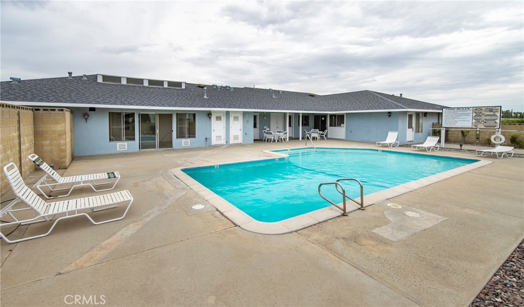 4133 West Wilson Street, Unit 168 Banning, CA 92220 - Photo 24 of 25 a view of a house with a swimming pool