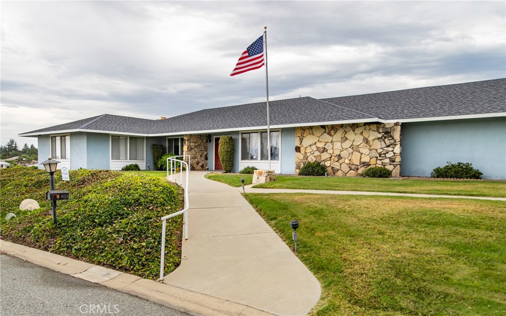 4133 West Wilson Street, Unit 168 Banning, CA 92220 - Photo 25 of 25 a front view of a house with garden