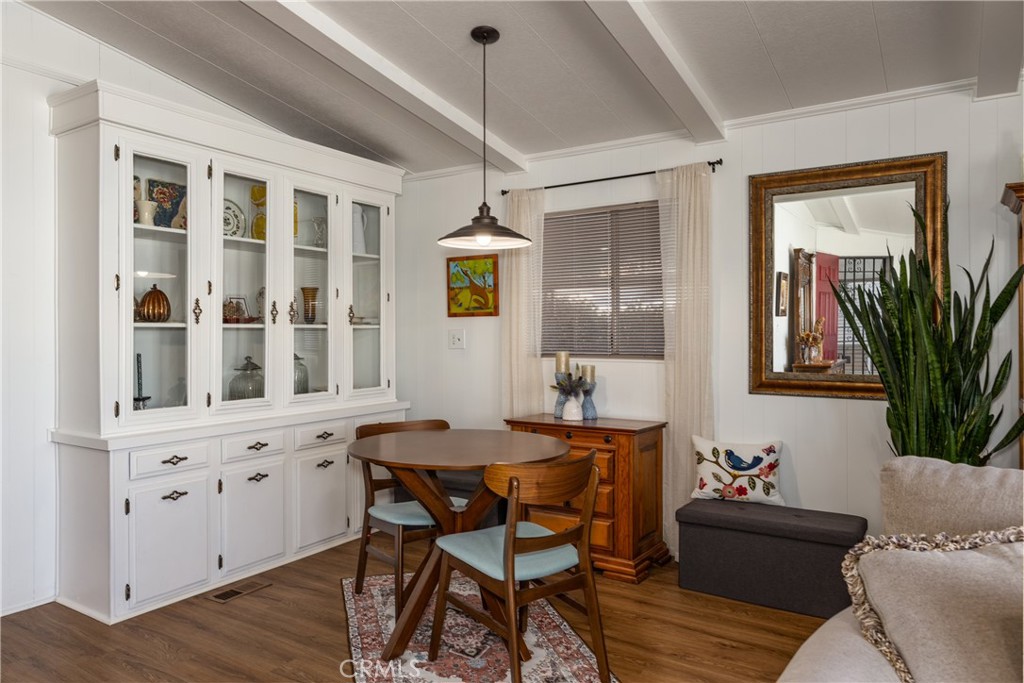 4133 West Wilson Street, Unit 168 Banning, CA 92220 - Photo 8 of 25 a view of a dining room with furniture and window