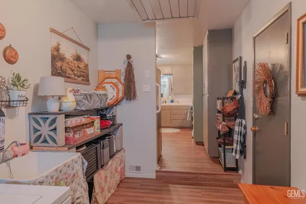 a kitchen with stainless steel appliances granite countertop a sink and a refrigerator