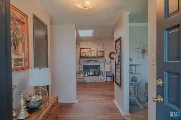 a kitchen with a sink cabinets and wooden floor