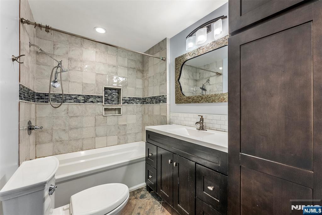 1 Dunn Road West Orange, NJ 07052 - Photo 1 of 20 a bathroom with a sink toilet and shower