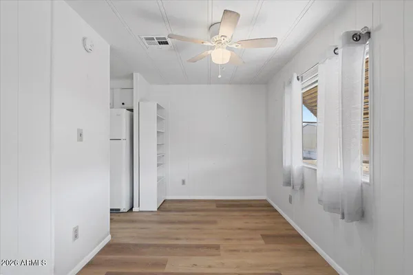 a view of an entryway with wooden floor