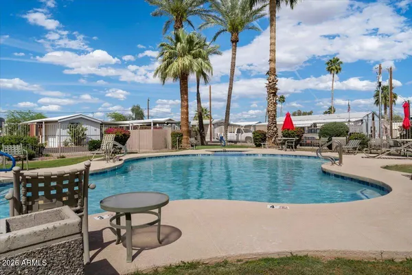a view of a swimming pool with a lounge chairs
