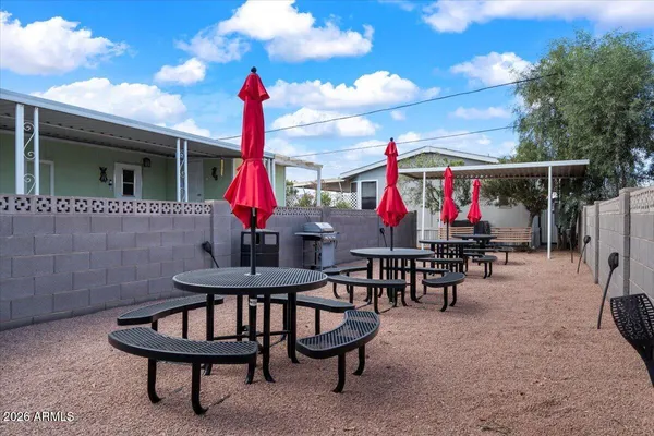 a view of a chairs and tables in patio