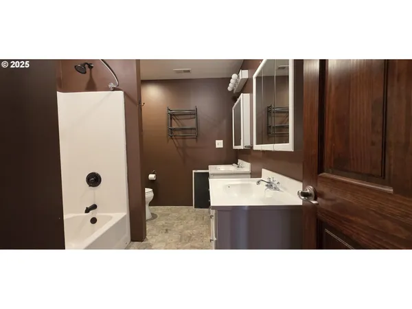 a bathroom with a sink and mirror
