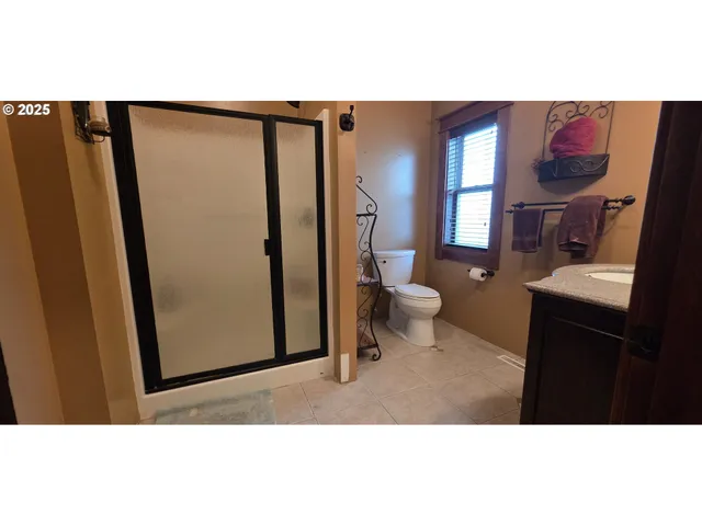 a bathroom with a toilet a sink and a mirror