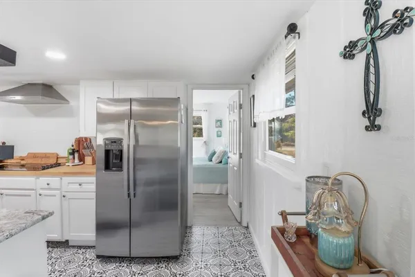 a kitchen with a sink and refrigerator