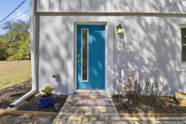a front view of a house with outdoor space and garden