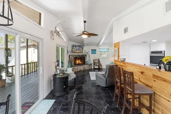 a kitchen with stainless steel appliances granite countertop a sink and a refrigerator