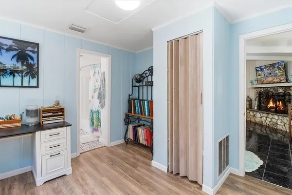 a view of a dining room with furniture and a table and chairs