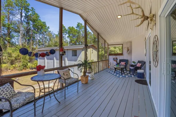 a view of a yard with furniture