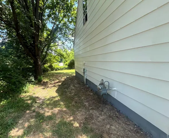 a backyard of a house with lots of green space