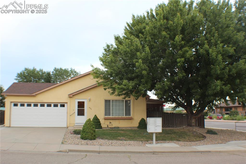 4706 Pioneer Road Pueblo, CO 81008 - Photo 1 of 23 a white house that has tree in front of it