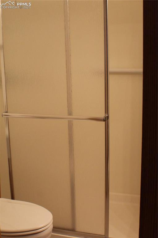 4706 Pioneer Road Pueblo, CO 81008 - Photo 12 of 23 a white toilet sitting next to a shower