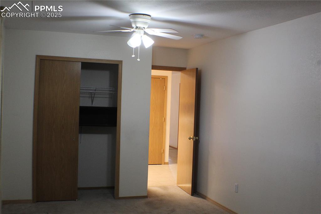 4706 Pioneer Road Pueblo, CO 81008 - Photo 14 of 23 a view of a hallway with a chandelier