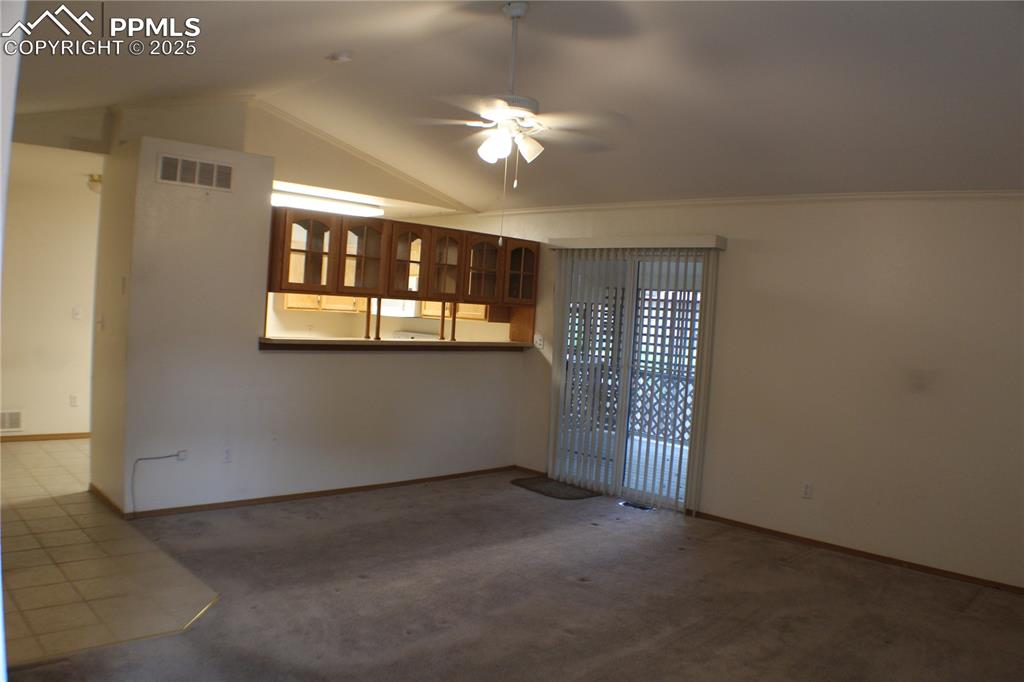 4706 Pioneer Road Pueblo, CO 81008 - Photo 2 of 23 a view of a livingroom with a ceiling fan and window