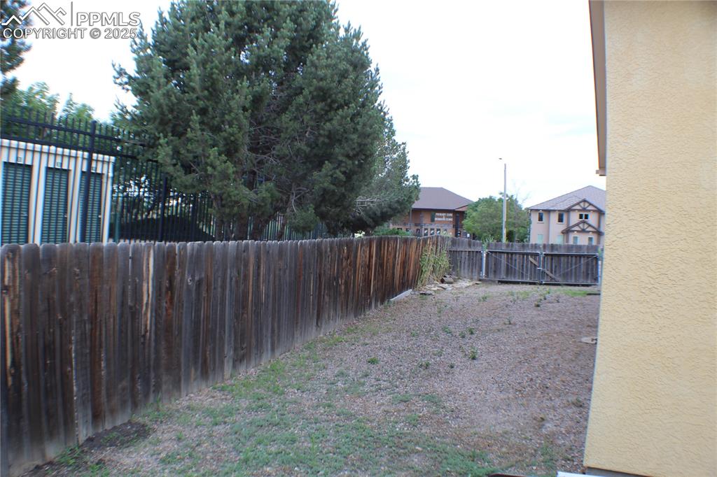 4706 Pioneer Road Pueblo, CO 81008 - Photo 21 of 23 a view of a wooden fence