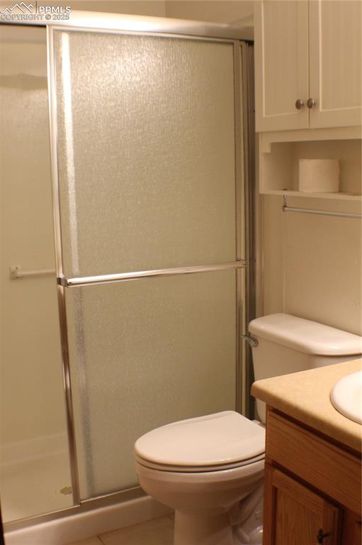 4706 Pioneer Road Pueblo, CO 81008 - Photo 8 of 23 a white toilet sitting next to a shower