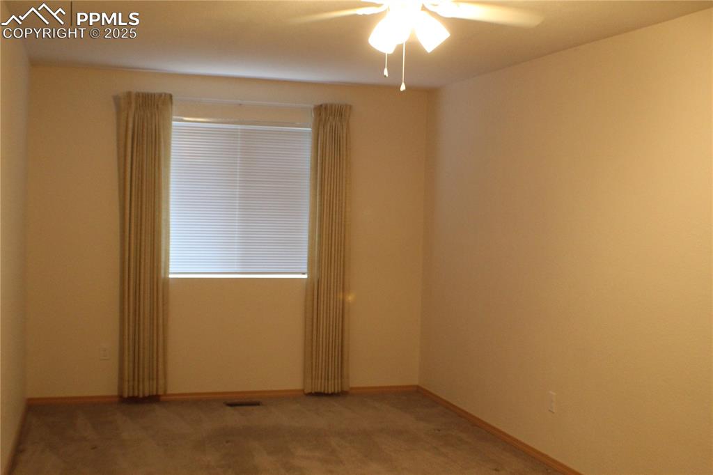 4706 Pioneer Road Pueblo, CO 81008 - Photo 9 of 23 an empty room with a window