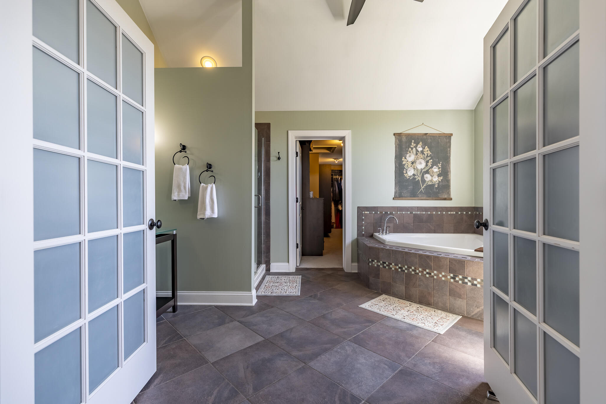 12492 Washington Street Crown Point, IN 46307 - Photo 18 of 43 a bathroom with a tub and shower