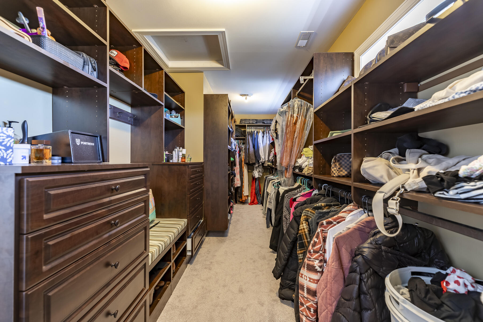 12492 Washington Street Crown Point, IN 46307 - Photo 23 of 43 a view of walk in closet with clothes and shoes