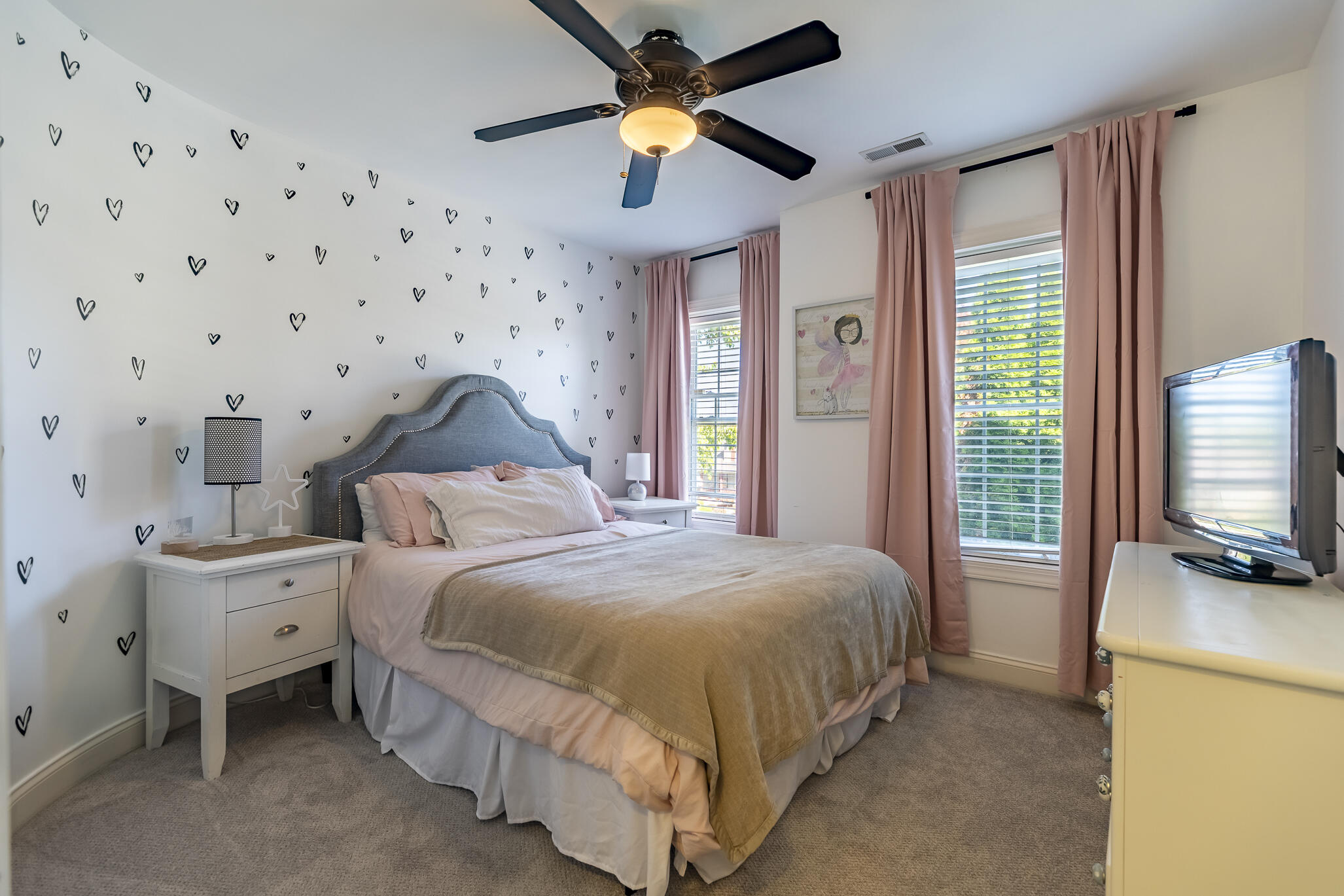 12492 Washington Street Crown Point, IN 46307 - Photo 27 of 43 a bedroom with a bed and a chandelier