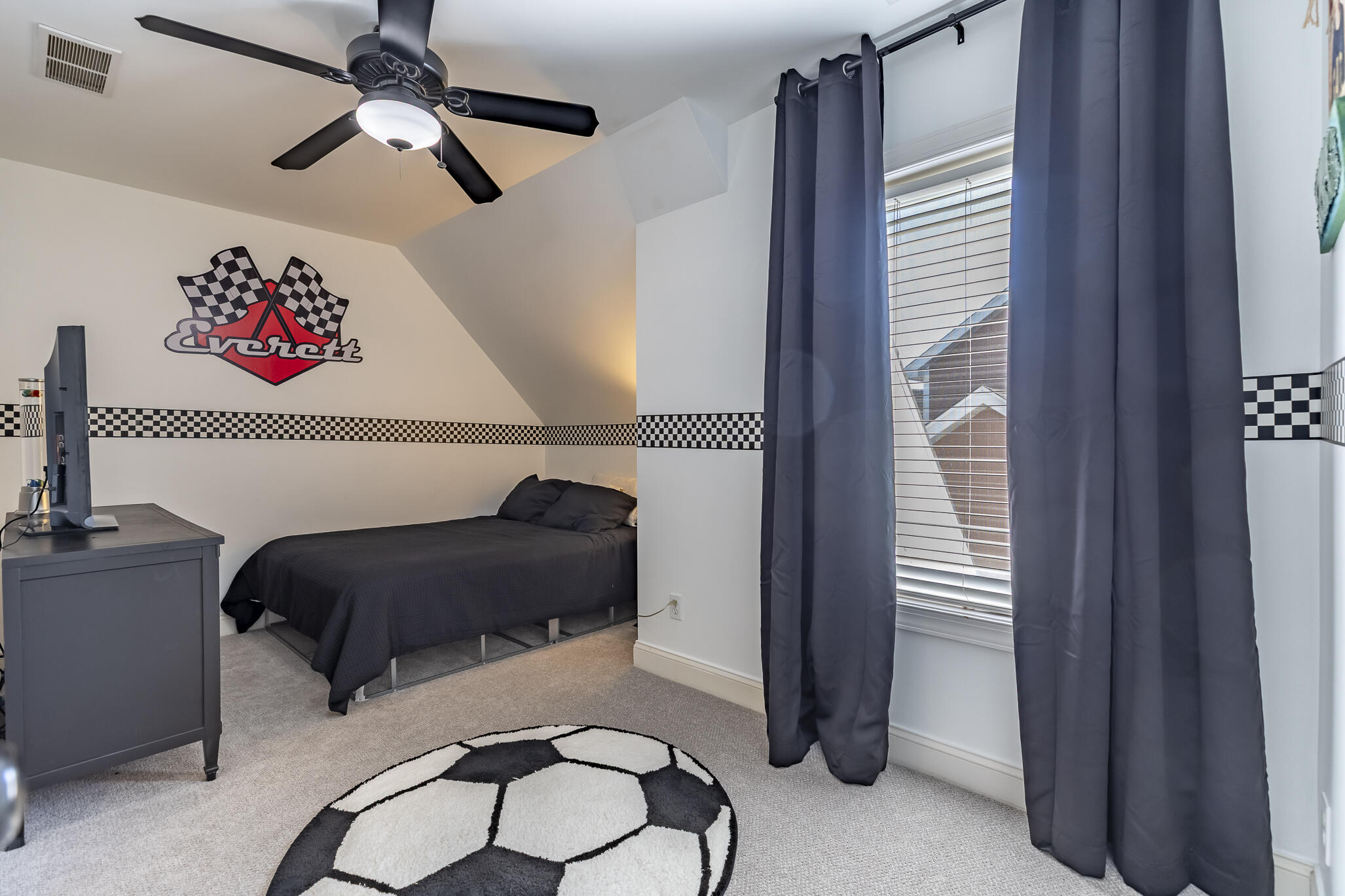 12492 Washington Street Crown Point, IN 46307 - Photo 28 of 43 a bedroom with a bed and a chandelier