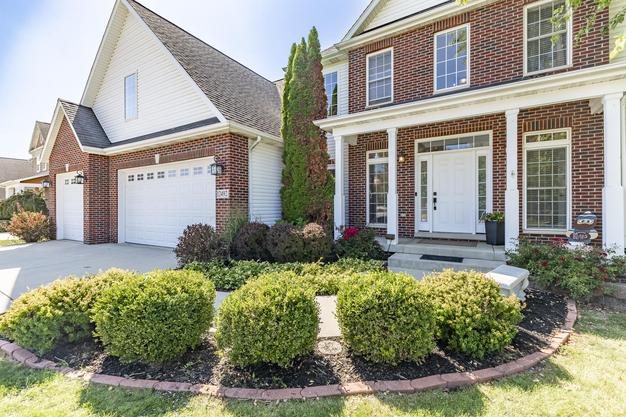 12492 Washington Street Crown Point, IN 46307 - Photo 3 of 43 front view of a house with a yard