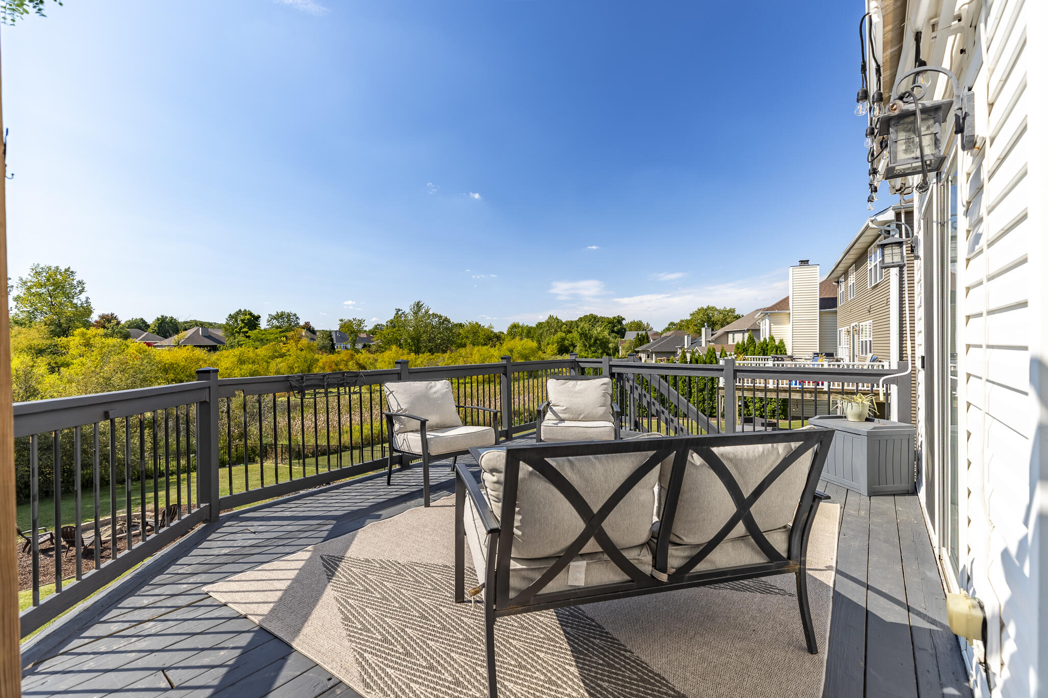 12492 Washington Street Crown Point, IN 46307 - Photo 38 of 43 a view of a balcony with wooden chairs and city view