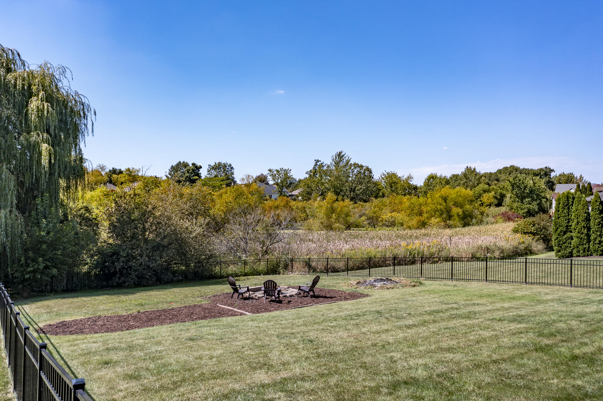 12492 Washington Street Crown Point, IN 46307 - Photo 40 of 43 a view of a big yard with an outdoor seating