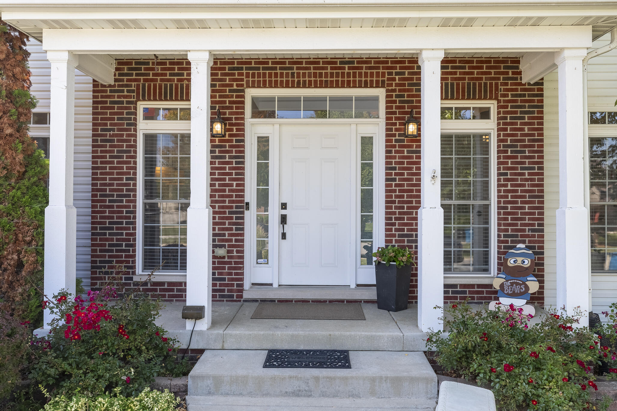12492 Washington Street Crown Point, IN 46307 - Photo 4 of 43 a front view of a house with a garden