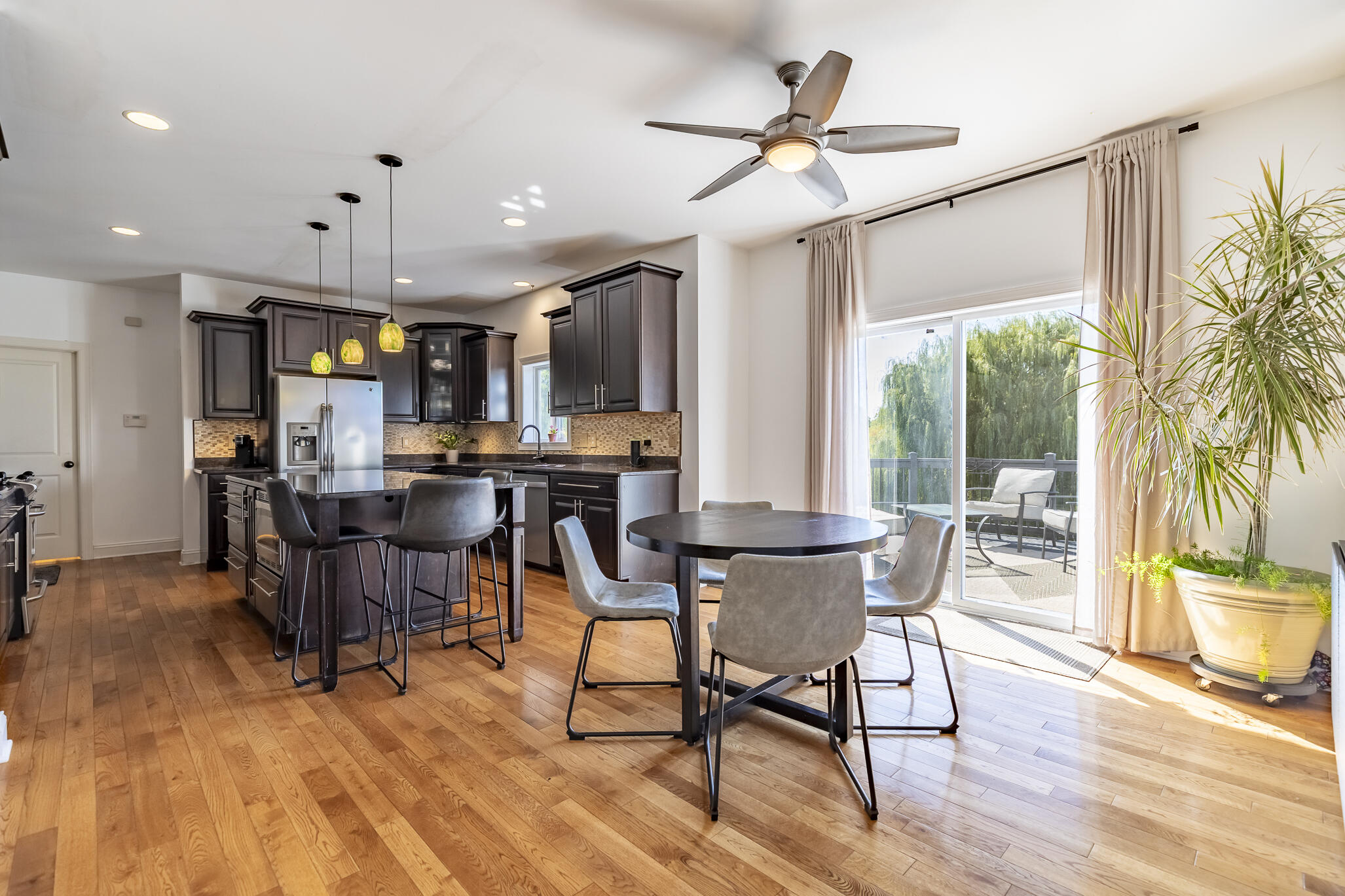 12492 Washington Street Crown Point, IN 46307 - Photo 6 of 43 a view of a dining room with furniture window and wooden floor
