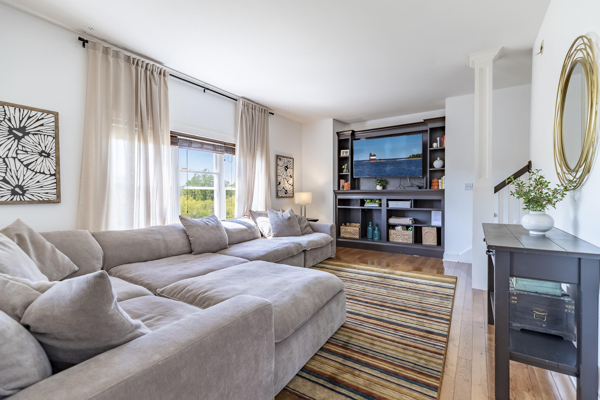12492 Washington Street Crown Point, IN 46307 - Photo 8 of 43 a living room with furniture and a flat screen tv