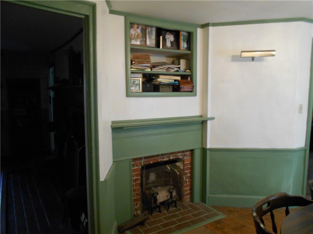 66 River Road Norridgewock, ME 04957 - Photo 17 of 33 Fireplace in dining room.