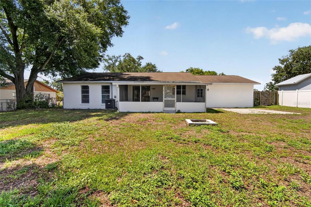 2340 Merrily Circle South Seffner, FL 33584 - Photo 44 of 52 a front view of house with yard and seating area